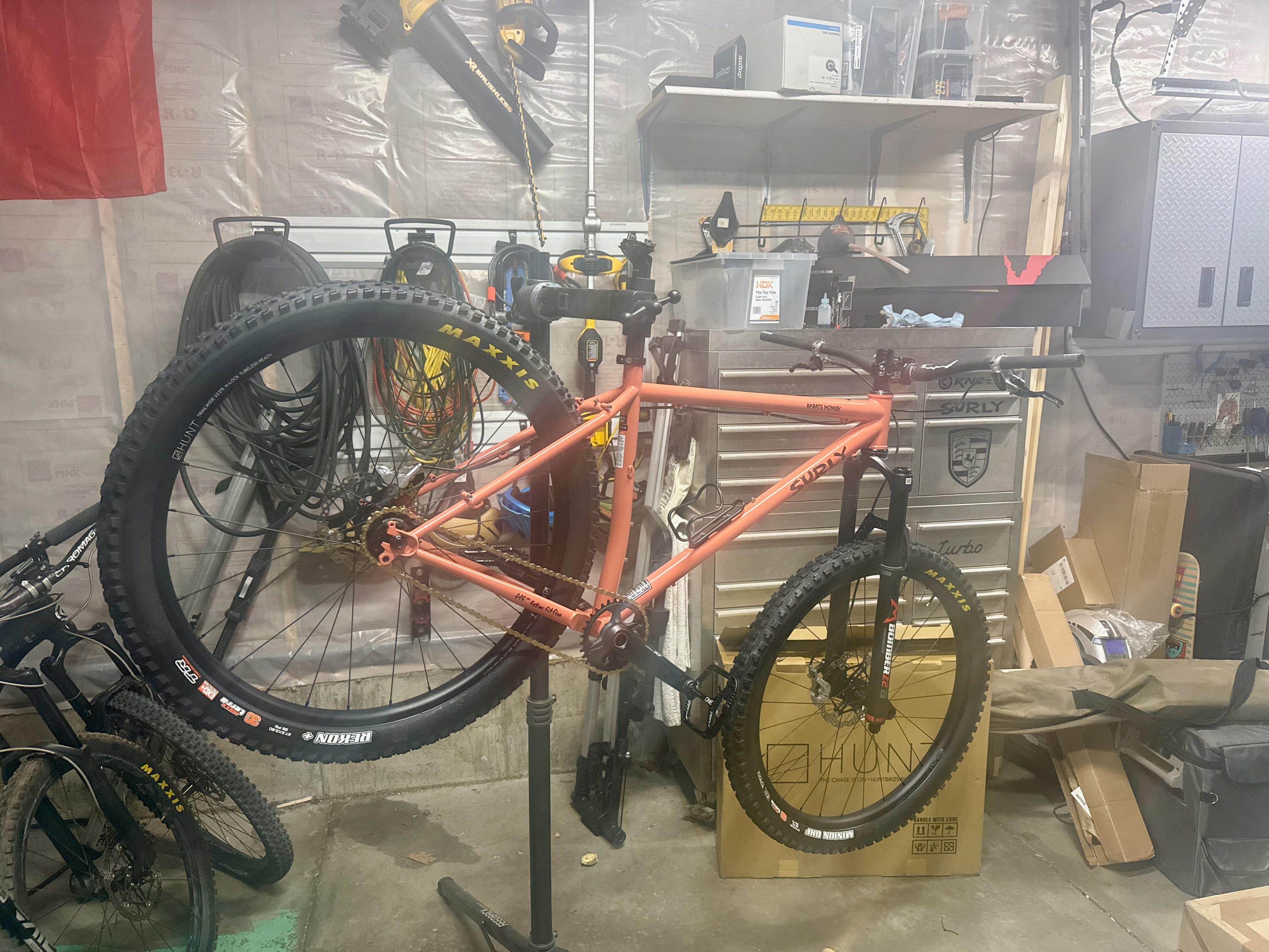Fully built Karate Monkey on a repair stand with a Hunt wheel box in the background