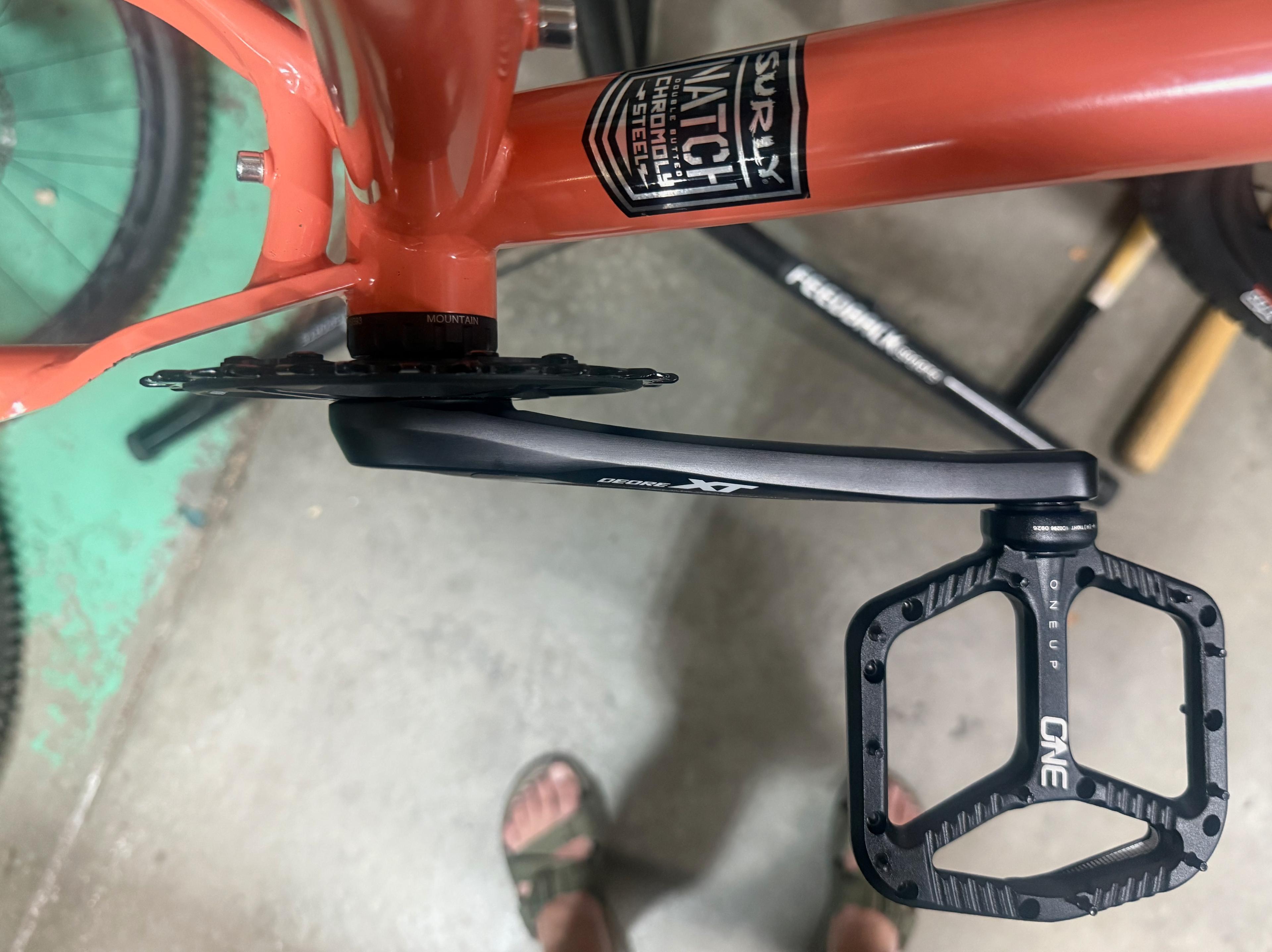 Overhead view of a OneUp flat pedal mounted on a Surly Karate Monkey with a Shimano Deore XT crank
